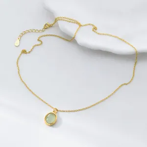 Close-up detail shot of the green fluorite oval pendant necklace on clean white background.