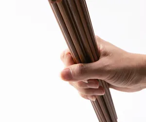 Detailed shot of wooden chopsticks bundle, natural solid wood texture, anti-slip design.