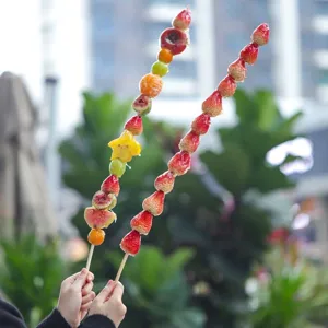 Extra long tanghulu fruit skewers with bamboo sticks, perfect for parties and sweet treats.