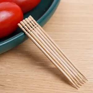 Disposable natural bamboo toothpicks, neatly bundled, eco-friendly household kitchen tool.