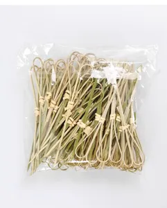 Pack of disposable bamboo knotted cocktail picks and decorative food skewers for burgers and fruit.