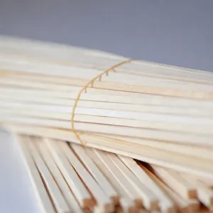 Square bamboo skewers for commercial barbecue, disposable wooden sticks for snacks and kebabs.