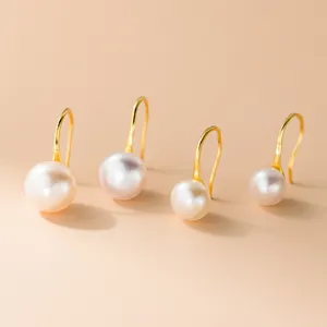 Pendientes de gancho de perlas de agua dulce minimalistas en plata s999 elegantes.