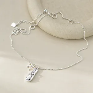 Collier en argent S925 avec pendentif chaussure de ballet, nœud et perle réglable.