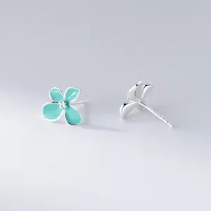 Mint green four-petal flower stud earrings detail shot, S925 sterling silver, cute floral jewelry.