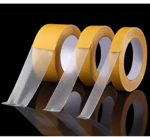 Detail view of strong double sided mesh cloth tape, high viscosity carpet tape structure features.