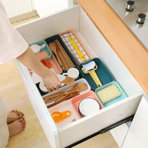Plastic drawer organizer box set for kitchen and makeup storage sorting compartments.