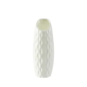 White plastic flower vase, ceramic imitation decorative ornament for home living room decor.