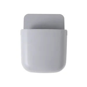 Wall mounted remote control storage box phone holder organizer for home living room storage.