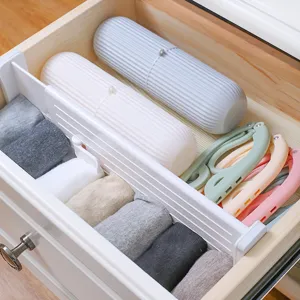 Adjustable plastic drawer dividers for wardrobe and cabinet organization, white storage organizer.
