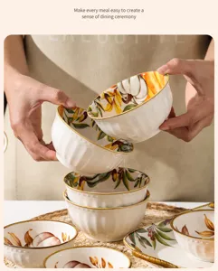 Detailed view of Nordic pumpkin ceramic bowl, hand-painted autumn leaf design with gold rim.