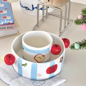 Cute ceramic bowl and mug set with blue stripes and red apple handles for home kitchen use.