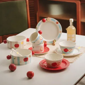 Cute apple pattern ceramic tableware set, bowl, plate, cup, and spoon for home daily use.