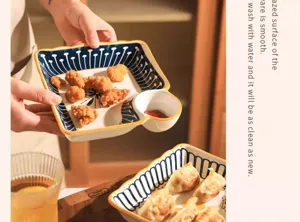 Ceramic divided dumpling plate with sauce dish, blue and white pattern tableware detail.