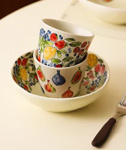 Retro ceramic bowl set with fruit watercolor pattern, elegant tableware detail for daily use.