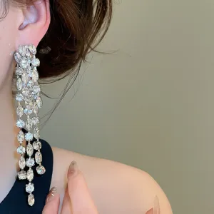 Luxury zircon long tassel earrings for women, sparkling diamond-shaped crystal ear studs.