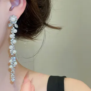 Long pearl zircon tassel earrings, elegant flower design for banquet wear, sparkling detail.