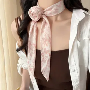 French vintage pink floral chiffon neck ribbon, elegant rose flower design accessory closeup.