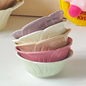Detail view of colorful ceramic dipping bowls featuring cute leaf vein embossed design.
