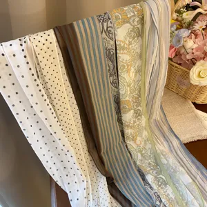 Detailed view of French pastoral style printed chiffon scarves featuring elegant polka dots.