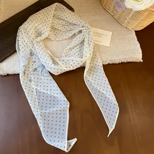 Elegant chiffon polka dot scarf with delicate butterfly print, soft fabric French style.