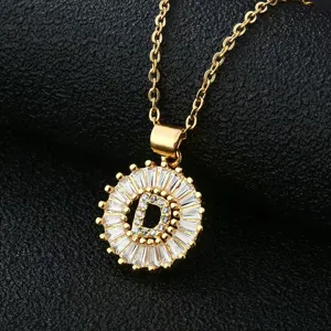 Gold-plated brass letter D pendant necklace with sparkling cubic zirconia baguette stones.