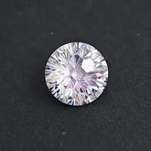 Detailed close-up of a brilliant round cut gemstone, showcasing sparkling facets and fire.