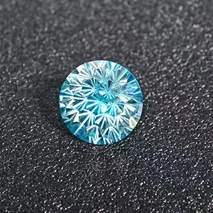Macro detail shot showing the brilliant cut facets and vibrant blue color of the gemstone.