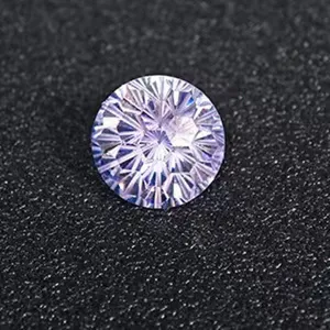 Close-up detail shot of a sparkling round cut light blue gemstone loose stone displayed.