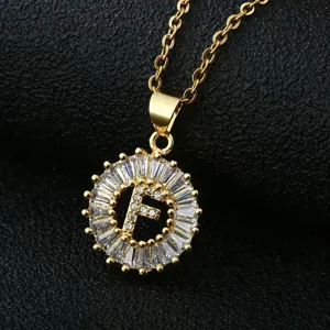 Gold-plated copper letter F pendant necklace with dazzling cubic zirconia crystals.