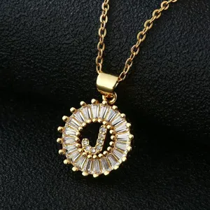 Close-up detail of the luxury gold-plated letter J pendant necklace, sparkling cubic zirconia round frame.