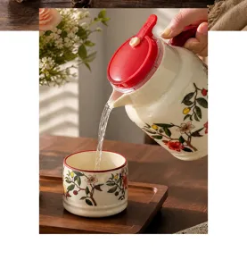 Ceramic teapot and teacup set with floral botanical pattern for home kitchen use
