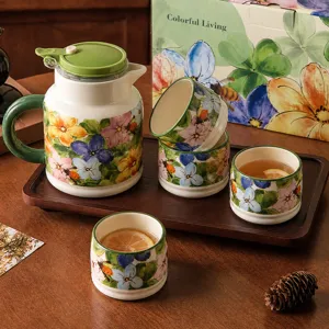 Ceramic water jug and tea cups set with wooden tray and floral pattern gift box for home.