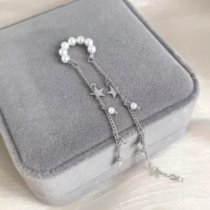 Pearl star tassel ear cuff detail, elegant non pierced clip on earring for women daily wear.