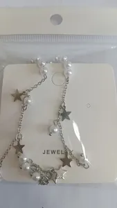 Pearl star tassel ear cuff set on display card, elegant non-pierced clip on jewelry for women.