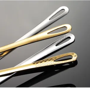 Stainless steel food tong handle detail, premium barbecue scissor clamp, durable finish.