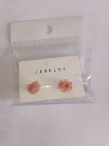 Cute pink rose flower stud earrings for women, sweet minimalist ear jewelry accessory set.