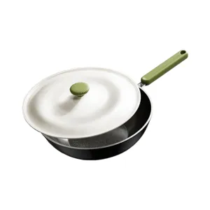Non-stick frying pan with white lid and green handle for home kitchen cooking and daily use.