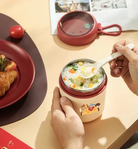 Portable insulated breakfast cup with spoon, stainless steel food jar for office and travel.