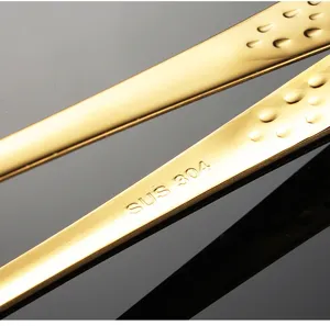 Stainless steel food tongs BBQ clip details close-up view showing 304 material.