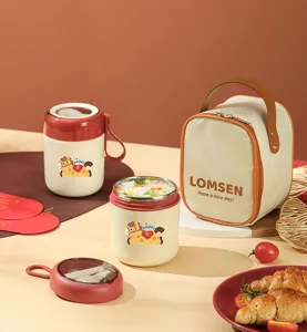 Detail view of portable insulated breakfast cup with spoon and matching lunch bag for daily use.