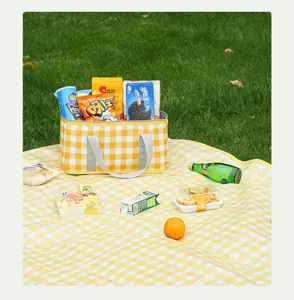 Yellow and white checkered insulated picnic bag for outdoor camping and food storage.