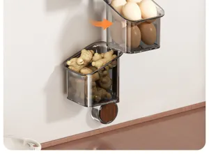 Cesta de almacenamiento de pared de cocina giratoria detalle para ajo y huevos.