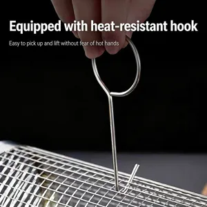 Stainless steel rolling BBQ grill basket detail showing heat-resistant lifting hook.