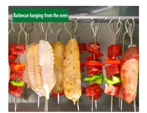 Stainless steel barbecue skewers detail showing the hanging design and sharp tips inside oven.