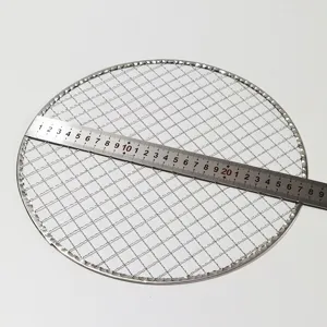 Portable round stainless steel barbecue grill net for camping and kitchen cooking use.
