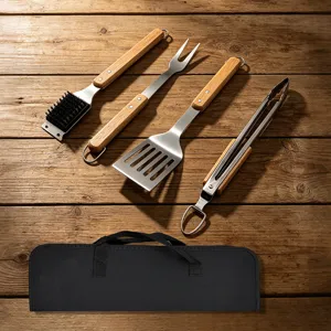 Stainless steel BBQ grilling tool set with wooden handle, includes fork, spatula, tongs and brush.