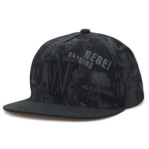 Close-up detail view of black hip-hop baseball cap with embroidered letter W and print.