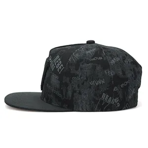 Streetwear black snapback cap with graffiti letter prints and side zipper pocket design.