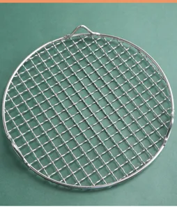 Durable stainless steel round grill net with feet for BBQ, air fryer and tea stove close view.